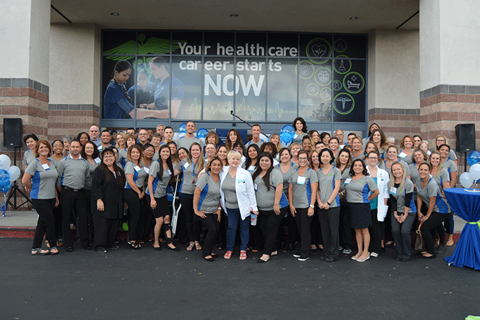 Faculty and staff pose during a 2019 Alumni celebration